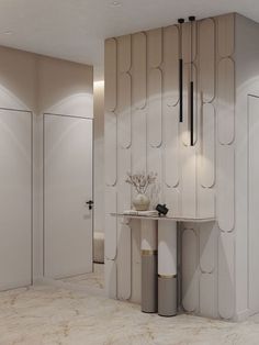 a room with white walls and marble flooring, two vases on top of the table