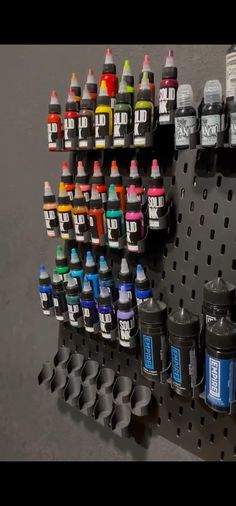 there are many different colors of ink on the shelf