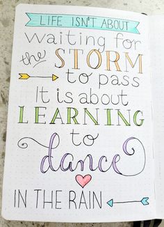 an open notebook with the words life isn't about waiting for the storm to pass it's about learning to dance in the rain