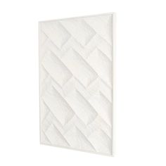 a white wall hanging on the side of a building with an abstract pattern in it