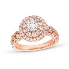 Plan a beautiful moment to share your love with this round diamond oval-frame engagement ring in rose gold. Created in 14K rose gold The 1/2 ct. round diamond center stone sparkles in a double oval-shaped frame of diamonds. An ornate twist design along the double-row shank shimmers with diamonds and polished ribbons. This engagement ring shines with 1-1/2 cts. t.w. of diamonds. Rose Gold Halo Ring With Diamond Accents, Rose Gold Halo Ring With Diamond Accents For Promise, Oval Frame, Oval Diamond, Plan A, Beautiful Moments, Round Diamond, Round Diamonds, The Row