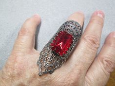 "YOU HAVE GOT TO HAVE B**LS TO WEAR THIS RING!! Totally AUTHENTIC vintage from the 1970's, this pewter tone ring is GINORMOUS....your choice between a Bright Emerald GREEN stone OR a Vibrant Ruby RED stone . The detailing on this piece is unbelievable..as you can see in the photos! Measures about 2 1/8\" long by 1\" wide, and is adjustable to fit most sizes. YOU WILL NOT SEE THIS ON ANYONE ELSE'S FINGER...THIS IS A VERY DIFFERENT RING. In great condition, new old stock, never worn. Choose your f Hippie Goth, Pewter Ring, Emerald Green Stone, Ring With Emerald, Goth Vintage, Ring Boho, Genuine Turquoise, Red Stone, Green Stone