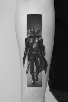 a black and white photo of a boba fett tattoo