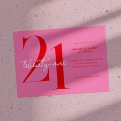 a pink 21st birthday party card with the number twenty one printed in white on it