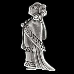 a silver colored pendant with an image of a woman holding a flower in her hand