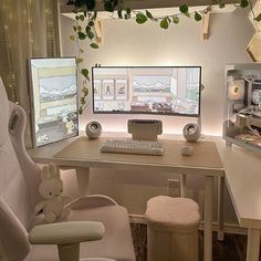 a computer desk with two monitors and a keyboard