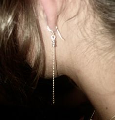 These minimalist  earrings are  so feminine . You will like the fluidity of the chain without the wiggling.   Very light. Dainty  or bohemian chic look. They follow naturally your neckline.  So discreet and at the same time a real statement once noticed. The ear wire is flattened and measures 1/2 inch.  The drop measures 3 1/2 inches for a pendant length of 4". Comes with clear earring backs. Feel free to message me if you have any questions. Thank you for your support <3 Sterling Silver Chain Earrings For Party, Sterling Silver Earrings With Silver Chain For Party, Dainty Silver Threader Earrings For Party, Silver Linear Earrings With Adjustable Chain For Party, Elegant Sterling Silver Threader Earrings With Adjustable Chain, Elegant Sterling Silver Threader Earrings, Elegant Silver Sterling Threader Earrings, Dainty Silver Earrings With Adjustable Chain, Elegant Sterling Silver Threader Earrings In Silver