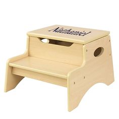 a wooden step stool with the word manhattan written on it's front and bottom