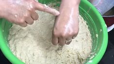 a person is mixing some food in a green bowl