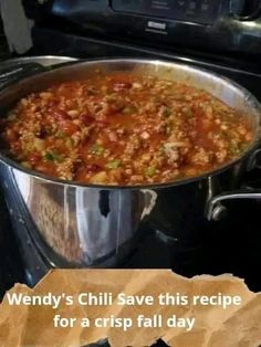 a large metal pan filled with food on top of a stove