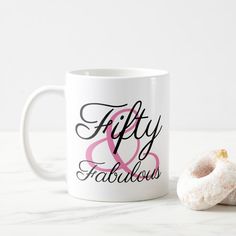 a doughnut and coffee mug with the words fifty and fabulous on it next to each other