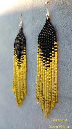 These handmade earrings are made of high-quality Czech beads and strong synthetic thread. They are elegant, fashionable, and highly versatile, suitable for everyday wear. Color: black,yellow . 100% hand made with love! Measurements: Length- about 11.5cm,Width -2 cm Materials: Sterling silver components Czech glass beads Nylon Thread Handwoven Yellow Beaded Earrings With Round Beads, Yellow Handwoven Beaded Earrings With Round Beads, Yellow Handwoven Drop Earrings, Yellow Beaded Earrings With Black Beads, Traditional Yellow Handwoven Beaded Earrings, Yellow Gold Beads Drop Earrings, Yellow Gold Beaded Drop Earrings, Yellow Beaded Dangle Chandelier Earrings, Yellow Beaded Chandelier Drop Earrings