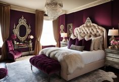 a bedroom decorated in purple and gold with an upholstered headboard, chandelier, mirror, rugs, and two lamps