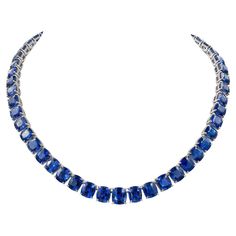 Presenting a sophisticated statement piece: the Ceylon Sapphire Diamond Tennis Necklace crafted from exquisite natural sapphires and diamonds, set in lustrous 18k white gold. Featuring 58 cushion sapphires totaling an impressive 130.26 carats, each stone certified by the esteemed GCI Laboratory for their Ceylon origin and thermal treatment indication. Accentuating the sapphire elegance are 489 dazzling diamonds, collectively weighing 1.49 carats, boasting a pristine F-G color and VS clarity. The necklace is fashioned from 18k white gold, with a substantial gross weight of 81.33 grams. With a total length of 17.5 inches (44.45 cm), the necklace offers versatility with a removable extension, allowing for a shorter length option of 16 inches (40.64 cm). Made by Spectra Fine Jewelry in 2022. Diamond Sapphire Necklace, 1stdibs Jewelry, Antique Diamond Necklace, Riviera Necklace, Blue Sapphire Jewelry, Diamond Pendants Designs, Sapphire Necklace Pendants, Diamond Tennis Necklace, Ceylon Sapphire