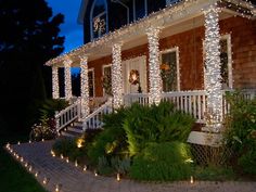 a house with christmas lights on the front porch