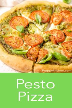 pesto pizza with basil and tomatoes on top