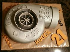 a birthday cake made to look like a blow dryer with the number twenty on it