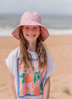 Bucket hat with a gorgeous dusty pink and cream checks deisgn on the outside and on the inner brim. Elasticated toggle around the head for the perfect fit. Cord and toggle under the chin to keep the hat in place. Wide brim (Measures for each size S: 6cm, M: 6.5cm, L: 7cm, XL: 7.5cm). Material: 100% Cotton including lining. Tested and certified as UPF50+ sun protection. Checks Design, Acorn Kids, Kids Sun Hat, Baby Bloomers, Baby Bundles, Tiny Cottons, Wool Beanie, Kids Boutique, Overall Dress