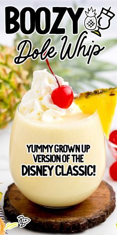 the cover of boozy dole whip with pineapple and cherries on top