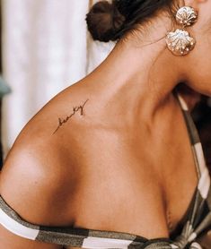 a woman with a small tattoo on her back