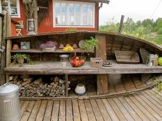 a wooden boat sitting on top of a wooden deck