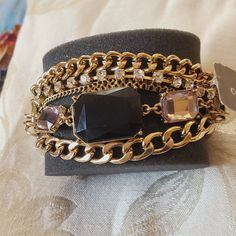 Black Crystals On A Gold And Leather Bracelet. Trendy Adjustable Black Chain Bracelet, Trendy Black Chain Bracelet For Party, Trendy Black Adjustable Chain Bracelet, Chic Metal Chain Bracelet For Party, Trendy Black Chain Bracelet, Black Metal Chain Bracelet For Party, Elegant Black Adjustable Chain Bracelet, Elegant Black Chain Bracelets, Elegant Black Chain Bracelet