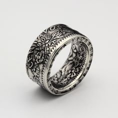 This Mexican coin ring is made from a fifty centavos silver coin here in the UK. The ring has details on both the interior and the exterior, featuring beautiful oak and laurel wreaths, bows and the liberty cap radiating light. The "liberty cap" is featured centrally with light radiating from behind it, on the opposite side of the ring is the denomination "centavos" and the date (seen here is 1907, but most dates from 1905 to 1917 can be acquired within reason). Inside this ring also features bea Coin Ring, Laurel Wreath, Silver Coin, Silver Coins, Perfect Ring, Interior Details, Band Rings, The Uk, Dates