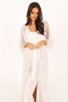 DETAILS
  This soft floral lace robe is the perfect addition to your lingerie wardrobe. With a long length style and relaxed sleeves, it's perfect for those romantic nights in or out on the town. The wrap front design of this luxurious robe ensures a flattering fit, while the detachable waist tie provides extra security and comfort.

soft floral lace robe
long length style robe
long lace sleeves
wrap front design
detachable waist tie
unlined

material - 100% polyester









SIZING

model is 5 Feminine Lace Robe For Wedding Night, White Lace Robe With Delicate Details, White Delicate Lace Robe, Lace Long Sleeve Sleepwear For Wedding Night, Elegant Long Sleeve Lace Sleepwear, White Long-length Sleepwear For Loungewear, Lace Robe With Lace Trim For Sleep, Lace Sleep Robe With Lace Trim, Lace Trim Sleep Robe