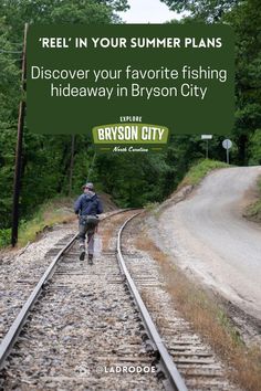 a man walking down train tracks with the caption'reelin in your summer plans discovery your favorite fishing hideaway in bryson