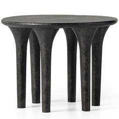 three black metal stools sitting next to each other on a white surface with no one in the photo