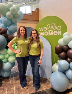 two women standing next to each other in front of balloons and archs with the words we are rag women on it