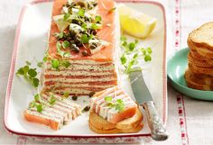 there is a plate with food on it and a knife next to the platter