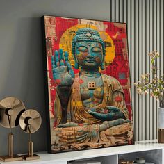 a buddha statue sitting on top of a white shelf next to a vase filled with flowers