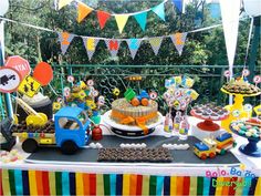 a table topped with lots of food and desserts