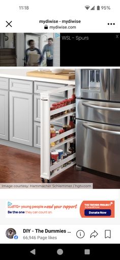 a kitchen with white cabinets and silver appliances