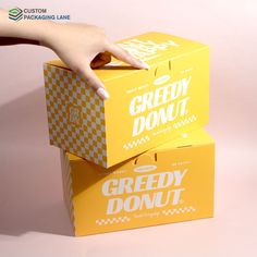 two boxes that are stacked on top of each other with the words speedy donut written on them