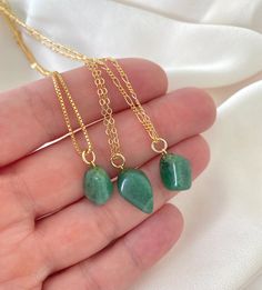 **Each piece in my shop, I personally create and photograph. (All photos are property of The Cord Gallery LLC) Thank you for supporting my small business.All Natural Aventurine Pendant NecklaceAdd a pop of green to your accessories with these pretty pendant necklaces! Features genuine Aventurine Gemstones, tumbled to a smooth, asymmetrical size and finish. Adorned on your choice of chain in the length of your choosing. Chain Options:Gold Filled Link ChainGold Filled Box ChainGold Filled Figaro C Emerald Necklace With Natural Aventurine Stones As Gift, Aventurine Necklace With Natural Stones For Gift, Aventurine Pendant Crystal Necklace For Gift, Aventurine Pendant Crystal Necklace As Gift, Gift Aventurine Pendant Crystal Necklace, Aventurine Natural Stone Necklace For Gifting, Gold Aventurine Necklace As Gift, Gold Aventurine Necklace For Gift, Green Aventurine Necklace