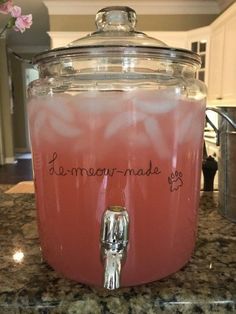 a crock pot filled with liquid sitting on top of a counter