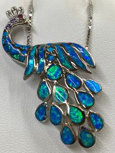 Iridescent Green and Blu Opal Peacock Necklace Peacock Design Jewelry Gift, Peacock Design Jewelry As Gift, Peacock Design Jewelry For Gifts, Elegant Blue Peacock Design Jewelry, Elegant Multicolor Opal Jewelry, Blue Bohemian Jewelry With Peacock Design, Bohemian Blue Jewelry With Peacock Design, Elegant Peacock Color Pendant Jewelry, Spiritual Jewelry With Peacock Design As A Gift