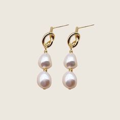 These stunning earrings will add the perfect touch of elegance to your wedding or special event outfit! Made with high quality materials, these Pearl earrings will be sure to impress in person and in photographs.... i n f o  +  d e t a i l s ...Approx 3.5 long x 1.3 cm wideMade with freshwater pearls - sizing and coloring subject to natural variancesAvailable in Gold plated metalPush on backings included*Due to hygienic reasons, no returns or exchanges permitted on hair accessories or earrings*. Baroque Pearl Drop Bridal Earrings, Baroque Pearl Bridal Earrings With Pearl Charm, Wedding Bridal Earrings With Baroque Pearl Drop, Baroque Pearl Charm Bridal Earrings For Wedding, Bridal Baroque Pearl Drop Earrings For Wedding, Pearl White Baroque Pearl Bridal Earrings, Dangle Baroque Pearl Bridal Earrings, Baroque Pearl Chain Earrings For Wedding, Wedding Pearl Earrings With Baroque Pearl Chain