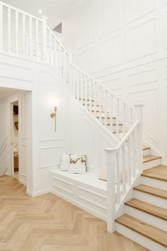 there is a white staircase in the house