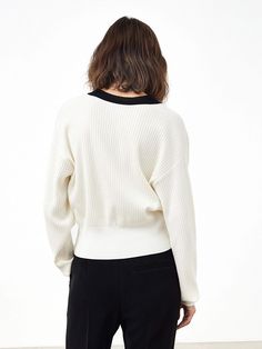 MO&Co. Women's Ribbed Knit Contrasting Cardigan Features : - Loose fit, drop shoulder- Ribbed knit finish- Contrasting design Code: MBB3CART04The back length of size S is 49.5cmMATERIALS & CARE Material: 72.8% Lyocell 27.2% PolyesterNot water wash, do not bleachSpread out in the shade to dry, do not tumble dryLow temperature iron, professional dry cleaningNotice:1. Wrap the metal parts before dry cleaning2. Ironing the padded cloth in the contrasting color partPlease select your own size in the Knit Cropped Sweater With Ribbed Cuffs For Layering, Knit Cropped Sweater With Ribbed Cuffs For Work, Chic Knit Cropped Sweater With Ribbed Collar, Black Ribbed Crew Neck Cardigan, Long Sleeve Cropped Sweater With Ribbed Cuffs For Work, Classic Oversized Ribbed Cardigan, White Knit Cropped Sweater With Ribbed Cuffs, Oversized Knit Cropped Sweater With Ribbed Collar, Chic Ribbed Collar V-neck Sweater For Winter