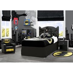 a batman themed bedroom with black and yellow decor