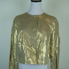 Whistles London Gold Metallic Linen Jacket / Top Size 8..Uk12..Fully Lined.. Covered Button Front.. Small Pockets Front..Fine Stitch Detail! Extra Button ...So Pretty And Versatile..Wear It Dress Up Or Down.. Made In Romania... Pleat In Back Gives You Some Extra Room .. Condition: New Without Tags Measures Sleeve 30 Bust 39 Hem Laying Flat Across 24 Includes Pleat Open Length 18 Chic Gold Blazer With Button Closure, Chic Gold Blazer With Buttons, Designer Gold Blazer With Button Closure, Designer Gold Blazer With Gold Buttons, Gold Chic Single Breasted Outerwear, Gold Long Sleeve Outerwear With Button Closure, Designer Single-breasted Gold Blazer, Gold Outerwear For Work In Spring, Chic Gold Single-breasted Outerwear