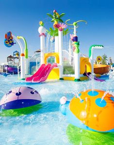 an inflatable water park with slides and floats