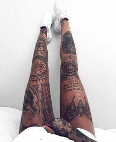 a person with tattoos on their legs and feet