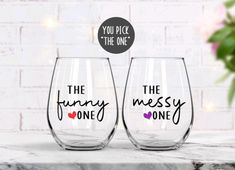 two wine glasses with the words, you did the one and the funky messy one