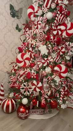 a christmas tree decorated with candy canes and ornaments