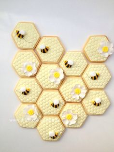 the cookies are decorated with honeybees and daisies on top of each other