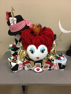 a table topped with lots of hats and cards